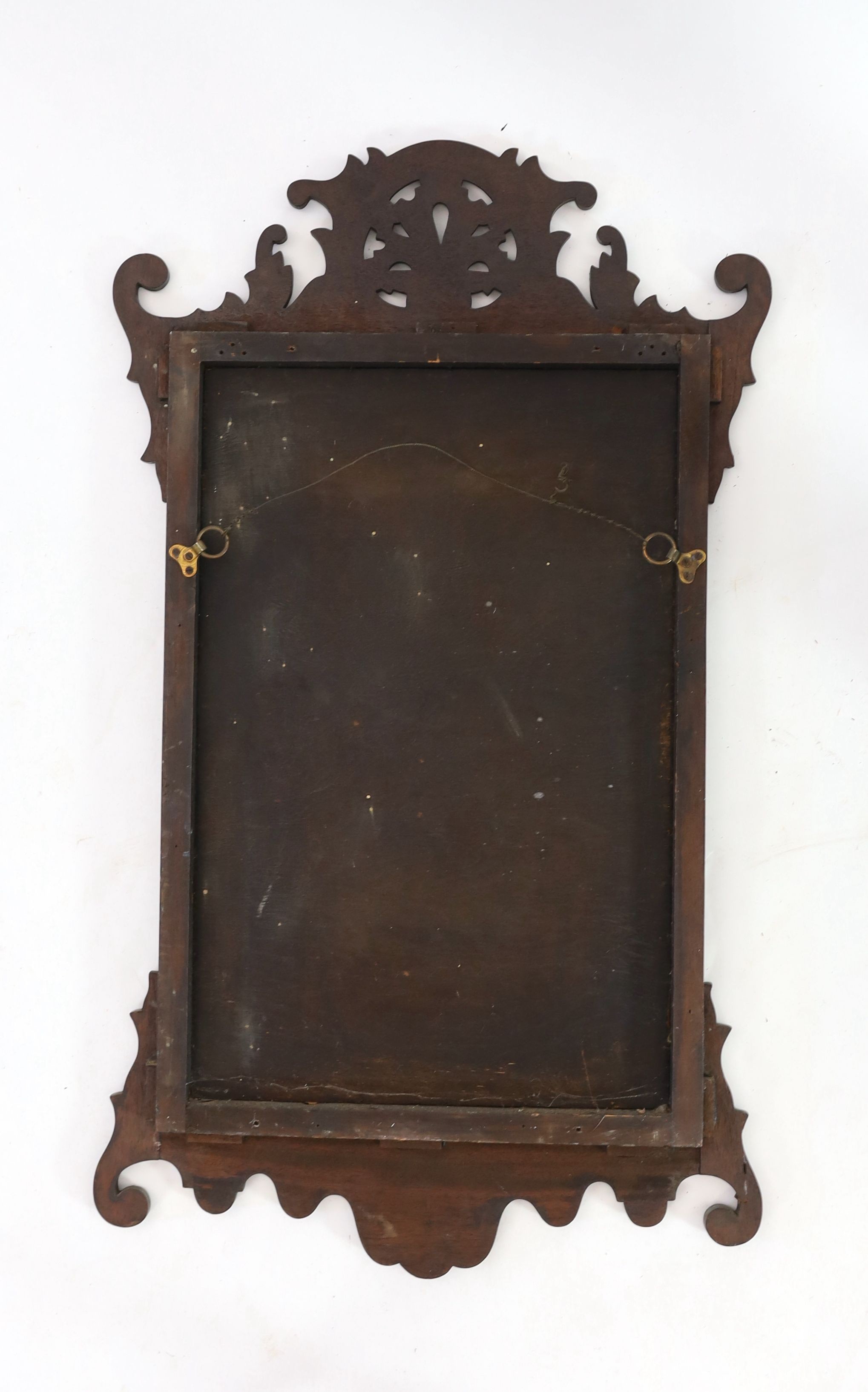 A George III style mahogany fret cut wall mirror, width 50cm height 88cm